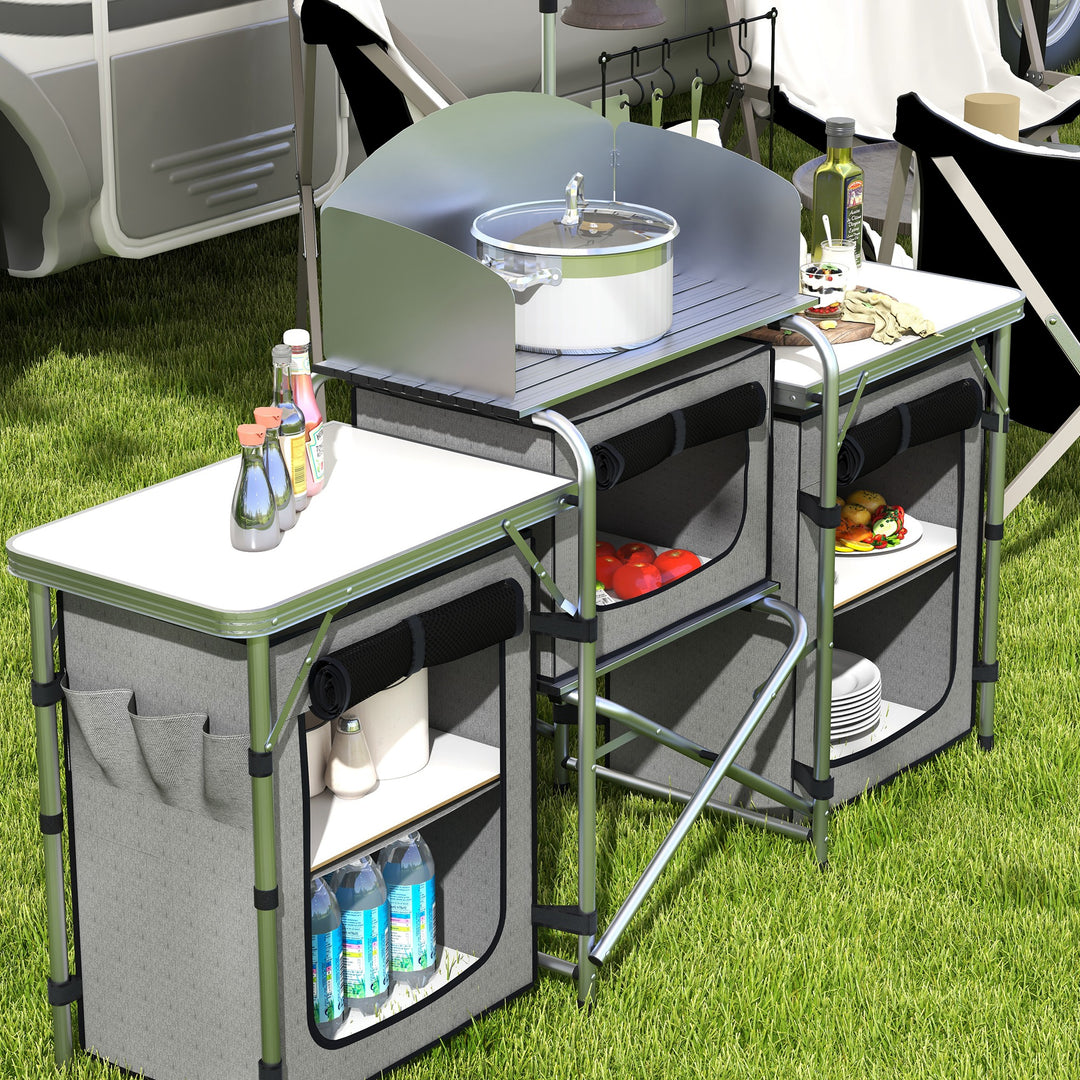 Outsunny Compact Camping Kitchen, Aluminium Portable Outdoor Cooking Station with Windshield, Storage Cupboards & Carry Bag for BBQ, Silver