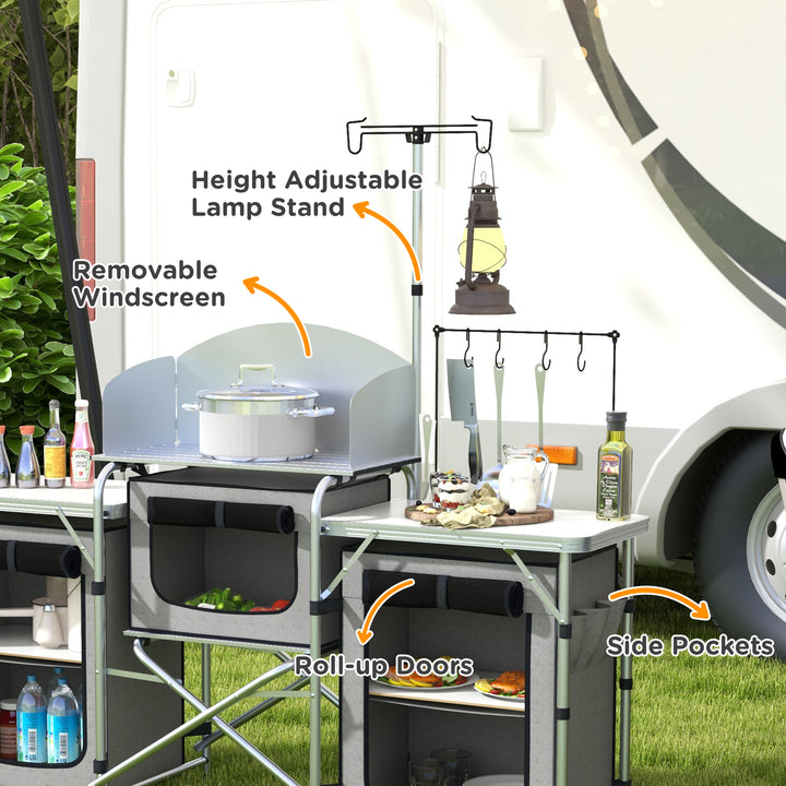 Outsunny Compact Camping Kitchen, Aluminium Portable Outdoor Cooking Station with Windshield, Storage Cupboards & Carry Bag for BBQ, Silver