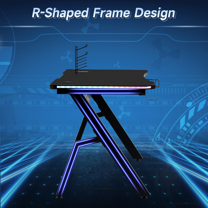 RGB 120 x 66cm Gaming Desk, Computer Table with Carbon Fibre Surface, Headphone Hook, Cup Holder, Controller Rack, Home Office Desk, Black