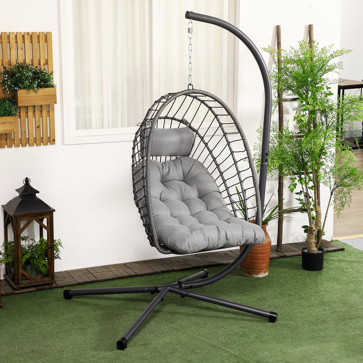 Outsunny Outdoor PE Rattan Swing Chair with Thick Padded Cushion, Foldable Basket Patio Hanging Chair with Metal Stand, Headrest