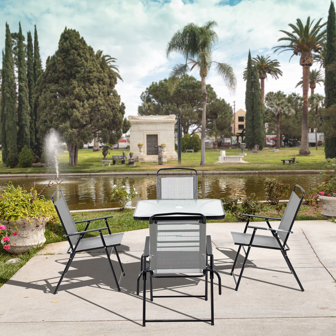 Outsunny 5 Piece Garden Dining Set Outdoor Dining Furniture 4 Folding Chairs, Glass Top Table with Parasol Hole, Texteline Seats, Black