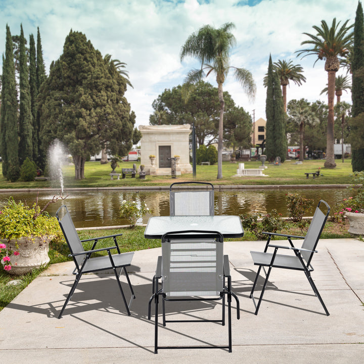 Outsunny 5 Piece Garden Dining Set Outdoor Dining Furniture 4 Folding Chairs, Glass Top Table with Parasol Hole, Texteline Seats, Black