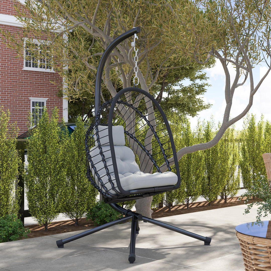 Outdoor PE Rattan Swing Chair with Foldable Basket and Cushion, Garden Patio Hanging Egg Chair with Metal Stand, Headrest for Indoor and Outdoor, Black