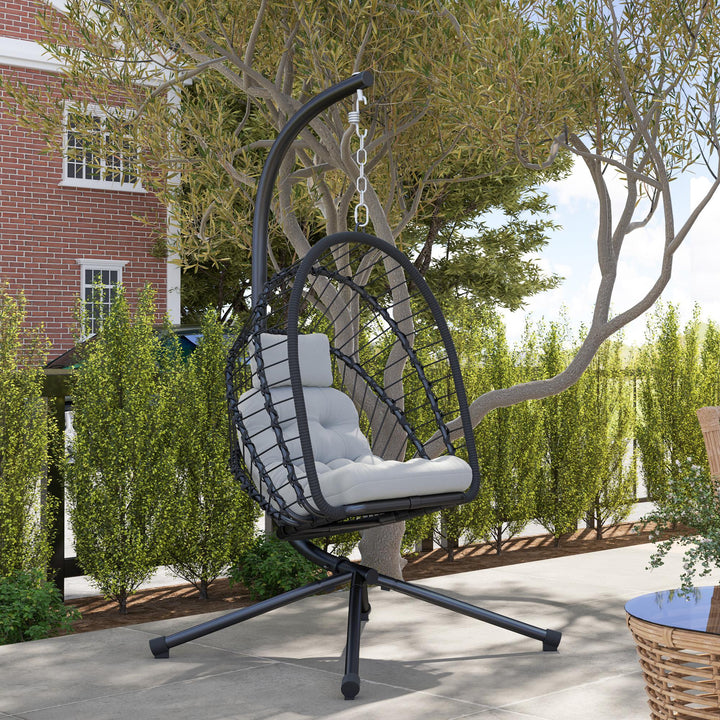 Outdoor PE Rattan Swing Chair with Foldable Basket and Cushion, Garden Patio Hanging Egg Chair with Metal Stand, Headrest for Indoor and Outdoor, Black